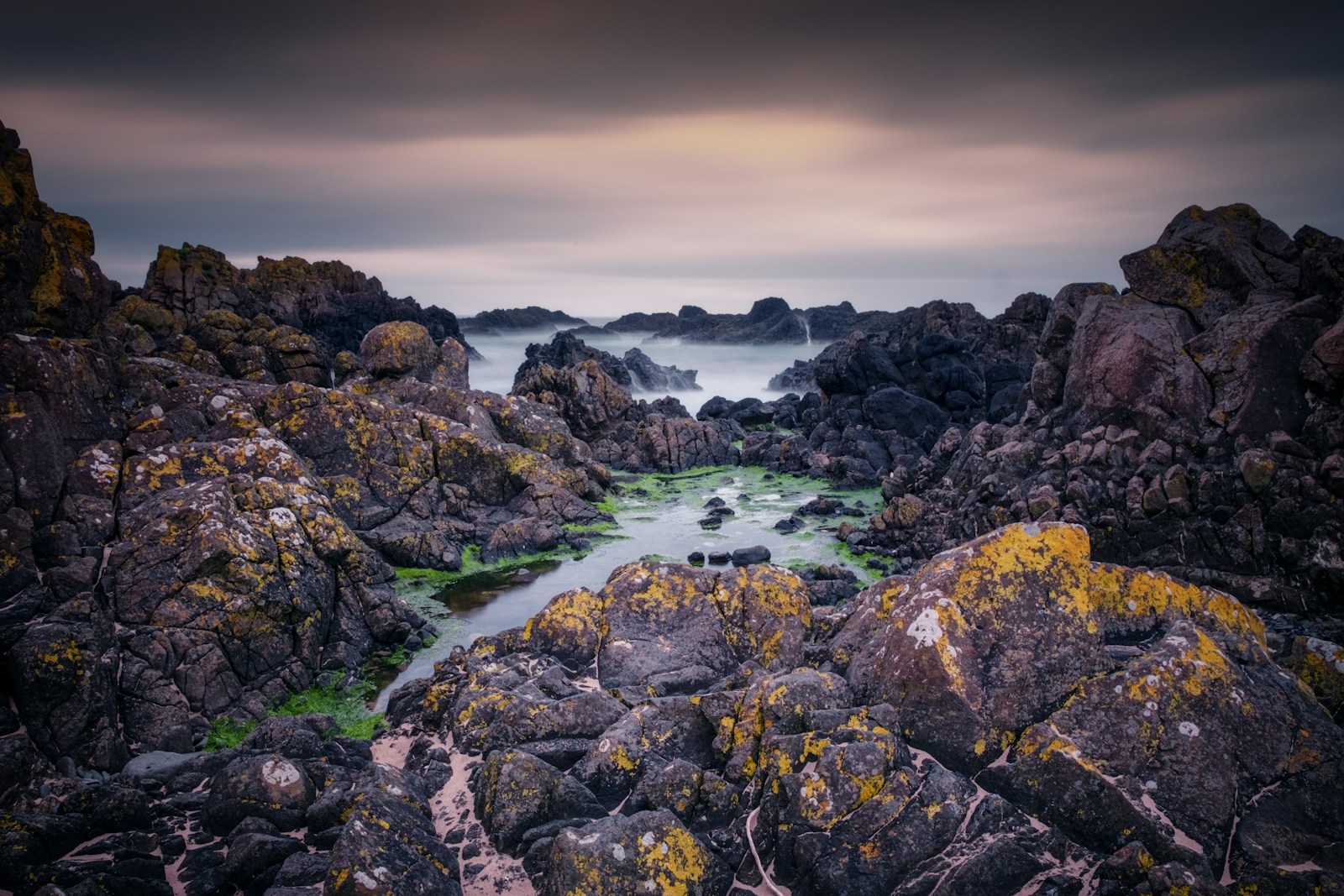 rocky shore with water falls