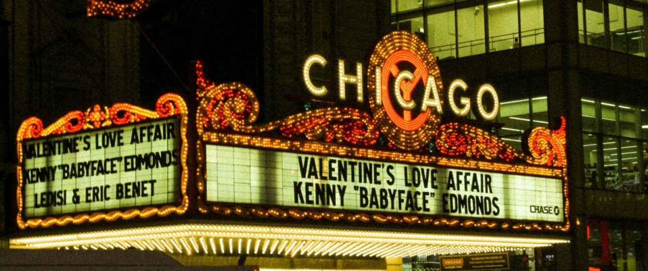 the chicago theatre marquee is lit up at night